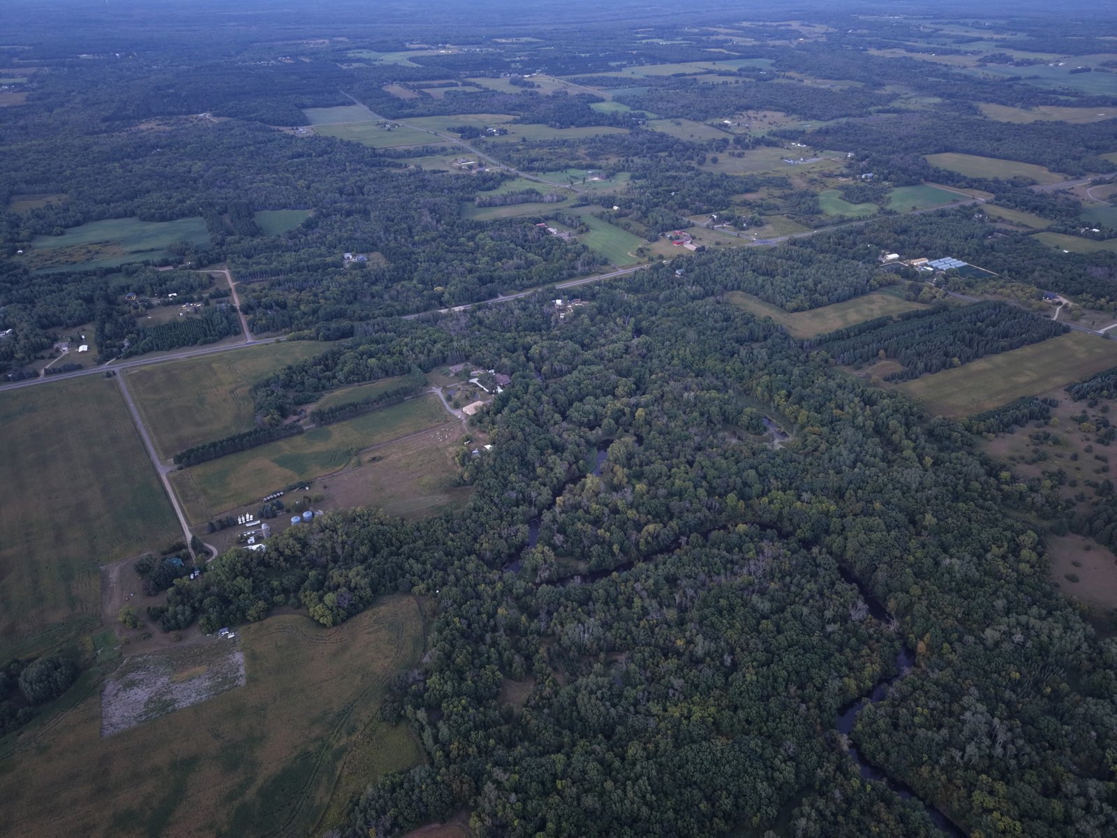 Woodland and farmland stretching to the horizon